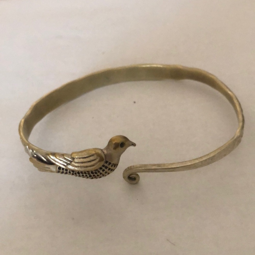 Adjustable embossed bird bracelet